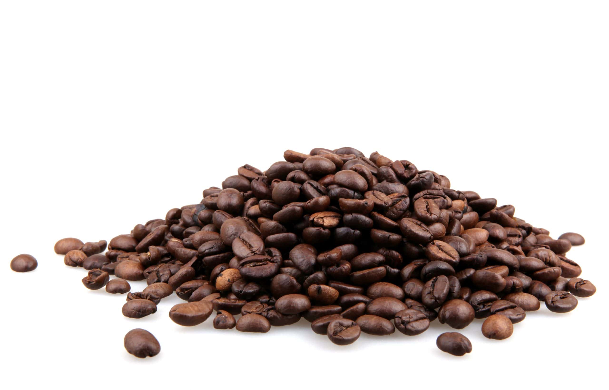Coffee beans on a dark background representing the global commodity market
